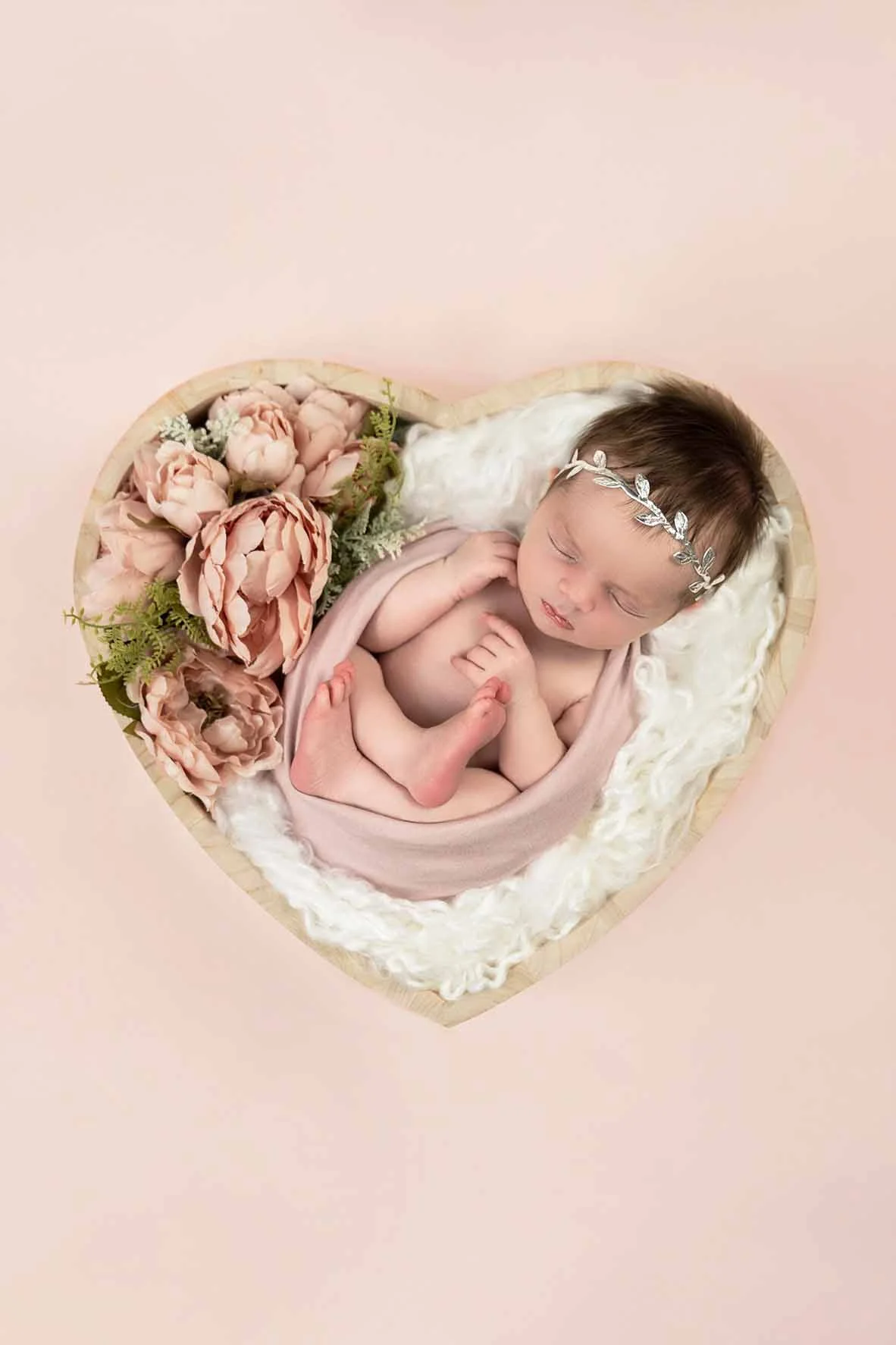 Newborn baby photography in heart shape