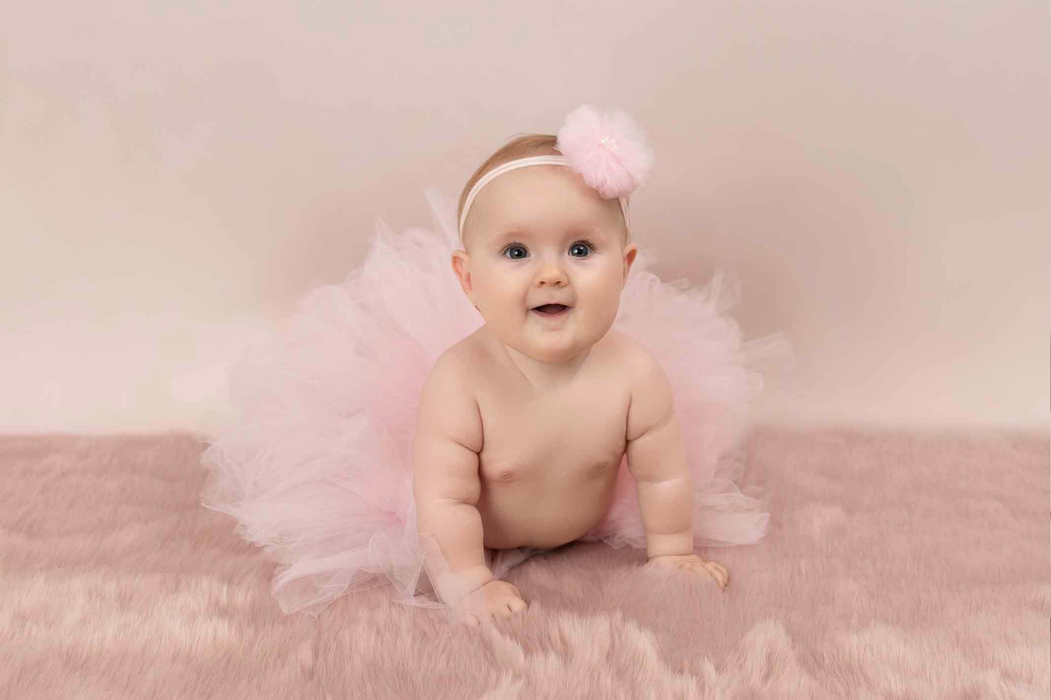 baby girl crawling in baby photoshoot