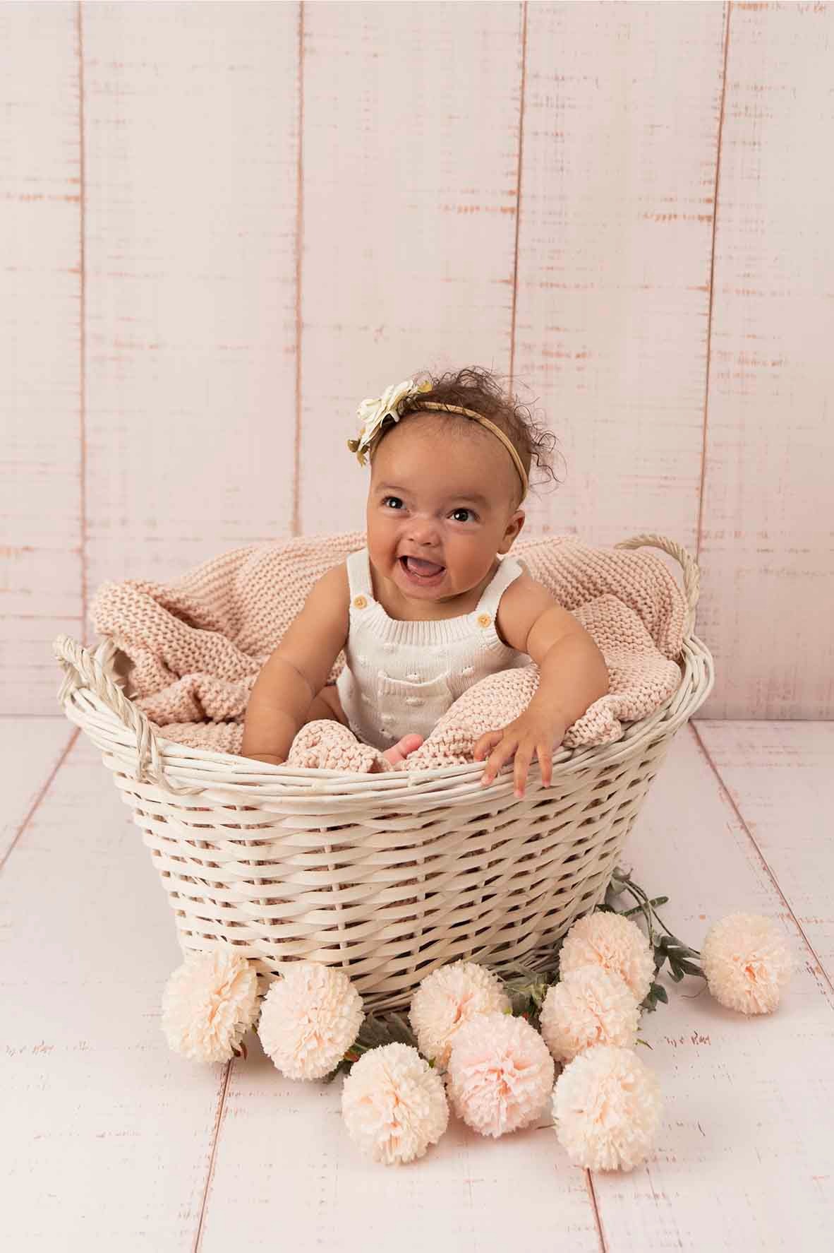 baby in a basket for photoshoot