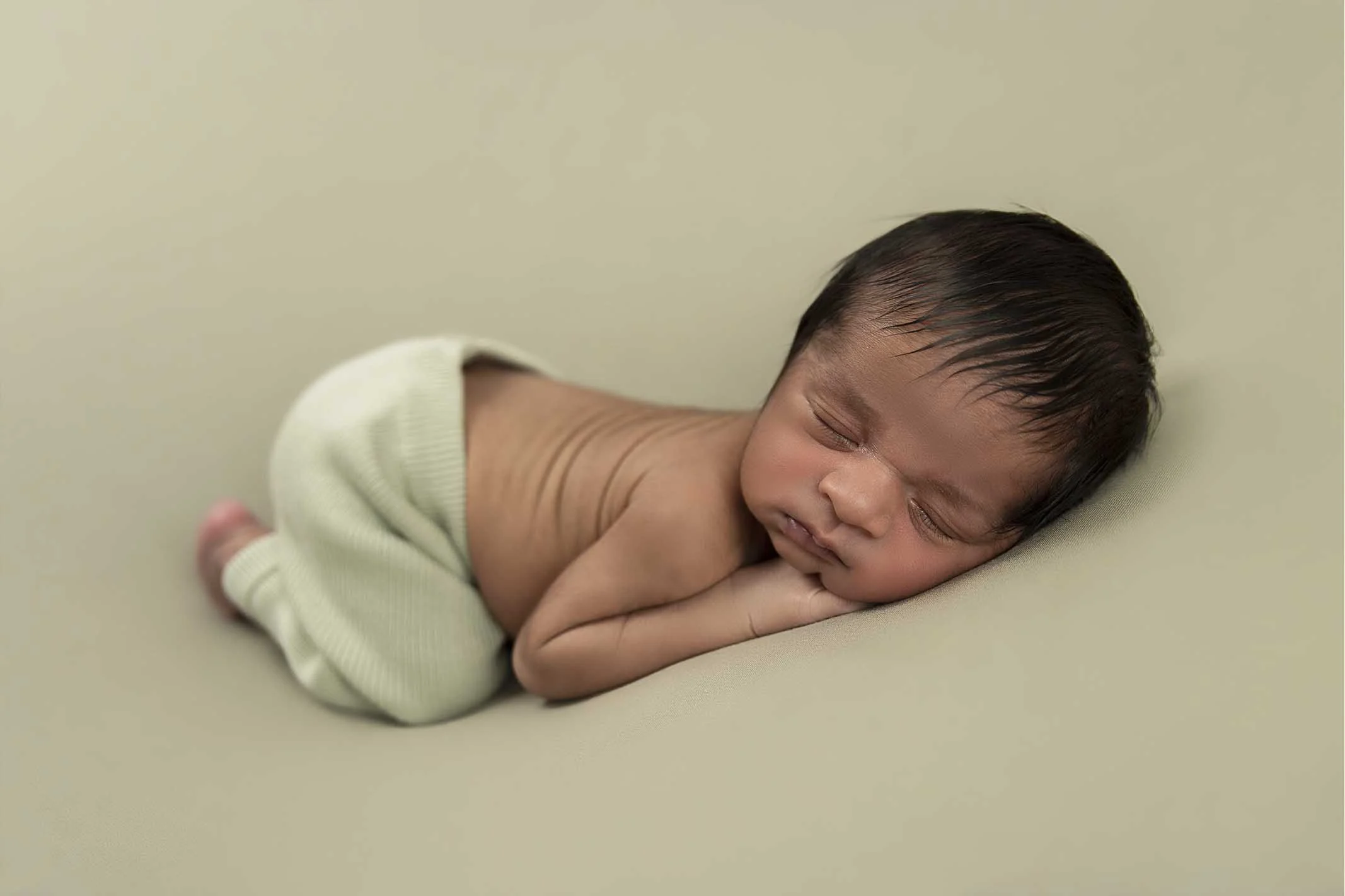 newborn boy sleeping for photoshoot