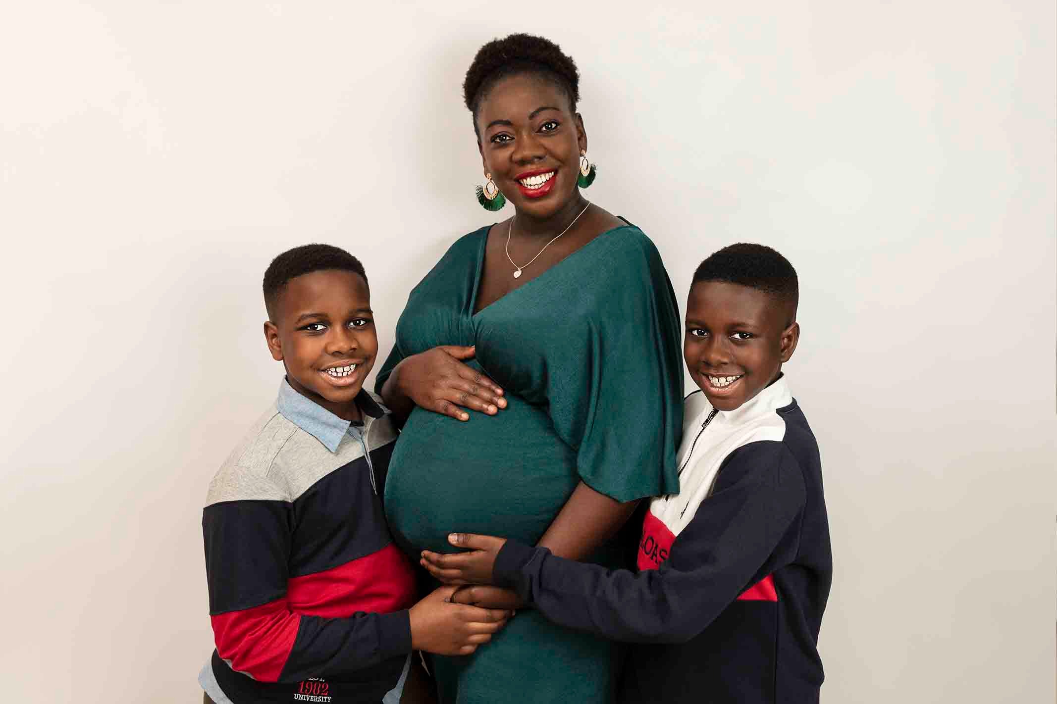 pregnant mother with her boys at maternity photoshoot